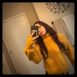 A distressed turtle neck